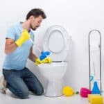 Using a plunger to unclog a toilet